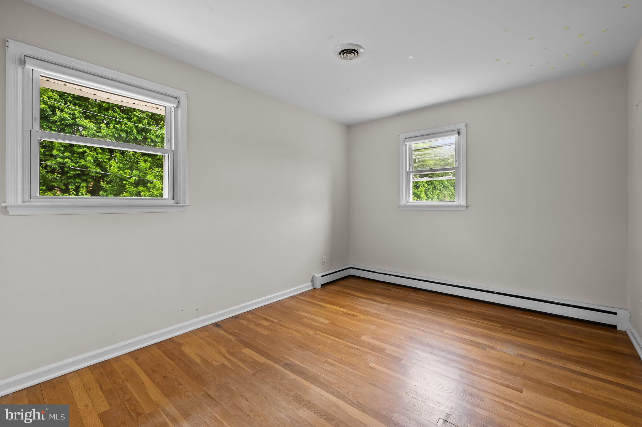114 Larkspur Road Newark, DE 19711 - Photo 16 of 23 a view of an empty room with wooden floor and a window
