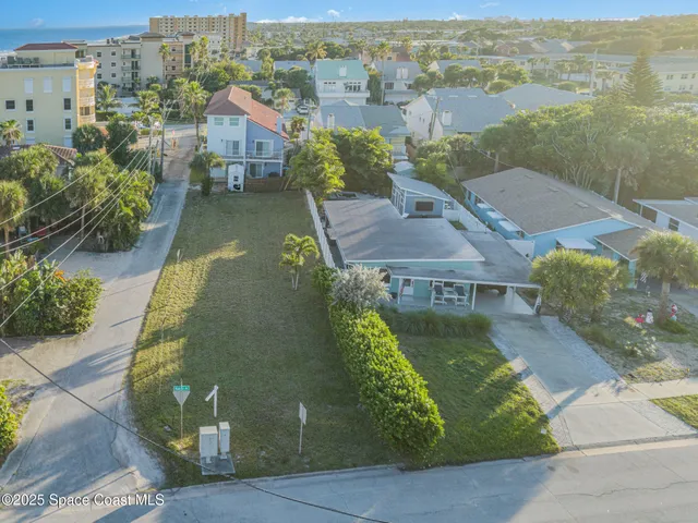 an aerial view of a house with a garden