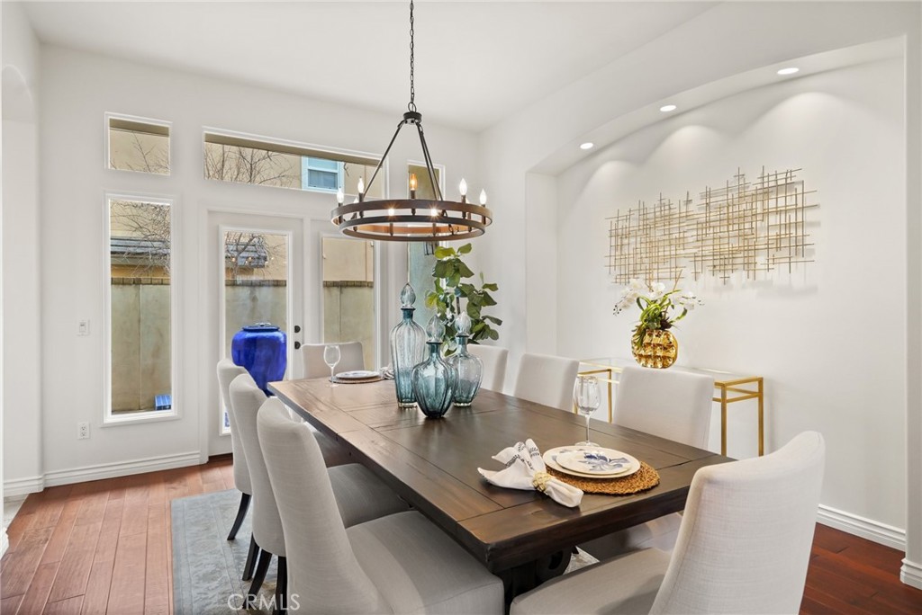 996 Blackbourne Point Oak Park, CA 91377 - Photo 12 of 75 a view of a dining room with furniture wooden floor and chandelier