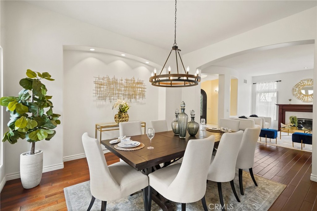 996 Blackbourne Point Oak Park, CA 91377 - Photo 13 of 75 a view of a dining room with furniture wooden floor and chandelier