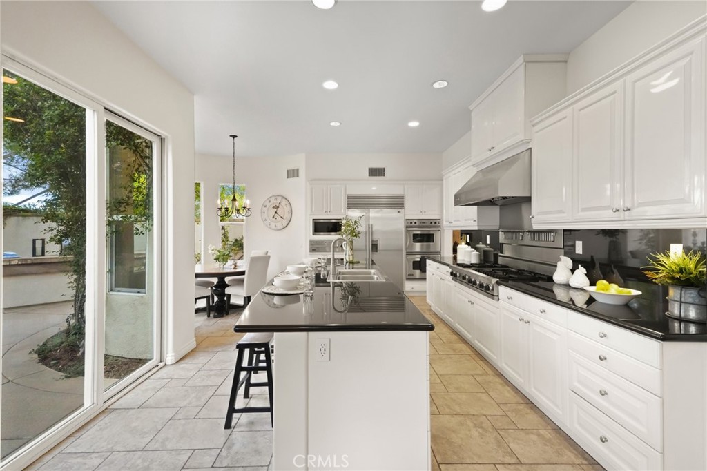 996 Blackbourne Point Oak Park, CA 91377 - Photo 17 of 75 a kitchen with refrigerator and cabinets