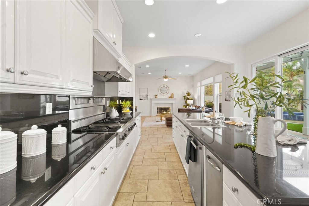 996 Blackbourne Point Oak Park, CA 91377 - Photo 20 of 75 a large kitchen with stainless steel appliances lots of counter space and a sink