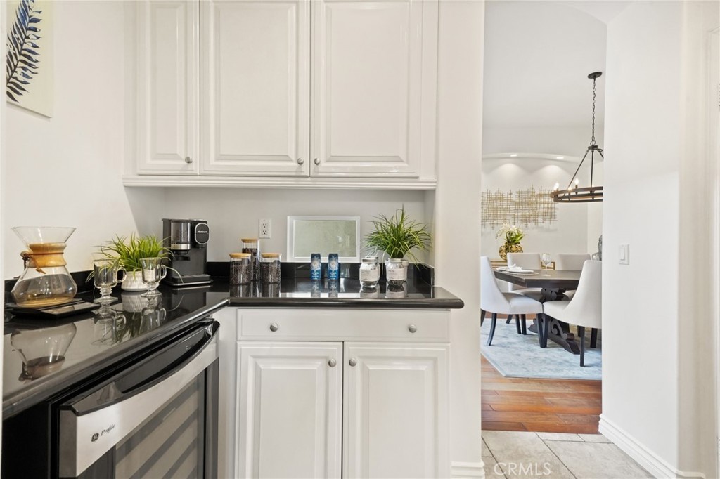 996 Blackbourne Point Oak Park, CA 91377 - Photo 23 of 75 a kitchen with stainless steel appliances granite countertop a sink and cabinets