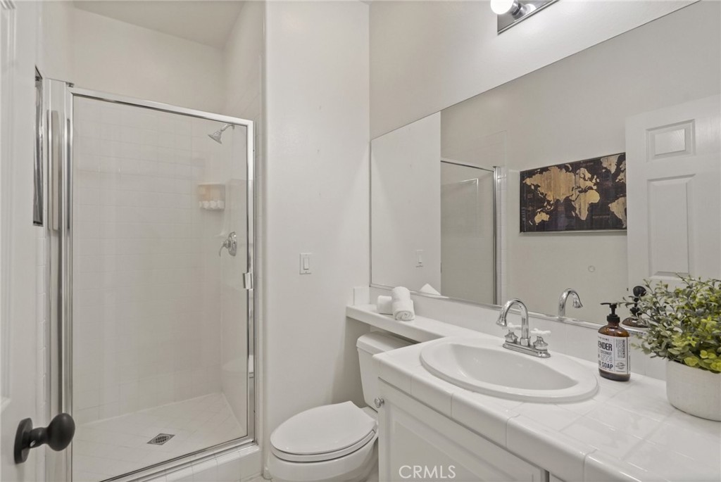 996 Blackbourne Point Oak Park, CA 91377 - Photo 31 of 75 a bathroom with a sink a toilet and shower