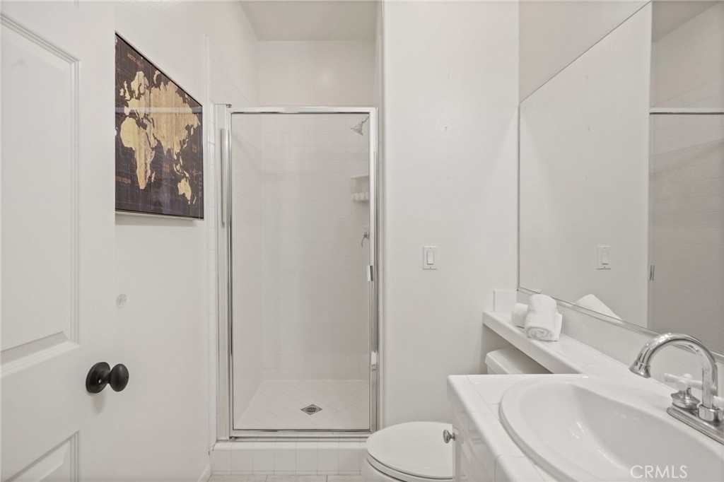 996 Blackbourne Point Oak Park, CA 91377 - Photo 32 of 75 a bathroom with a toilet sink and shower