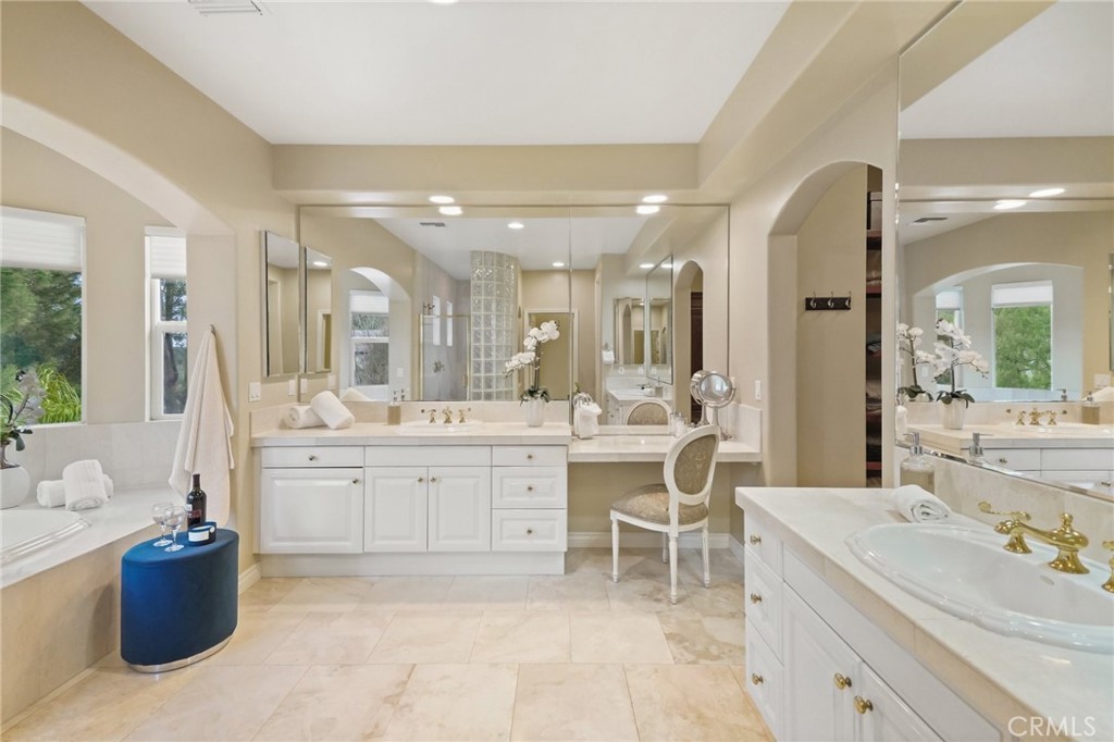 996 Blackbourne Point Oak Park, CA 91377 - Photo 42 of 75 a large bathroom with a large tub sink vanity and granite