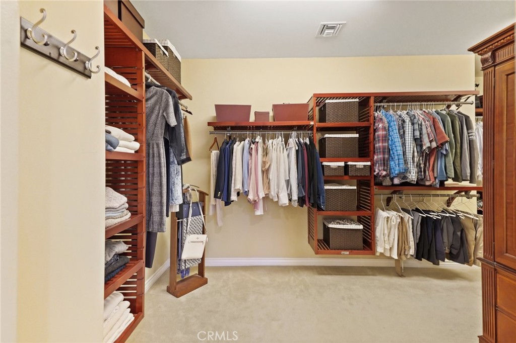 996 Blackbourne Point Oak Park, CA 91377 - Photo 43 of 75 a view of walk in closet with clothes and shoes
