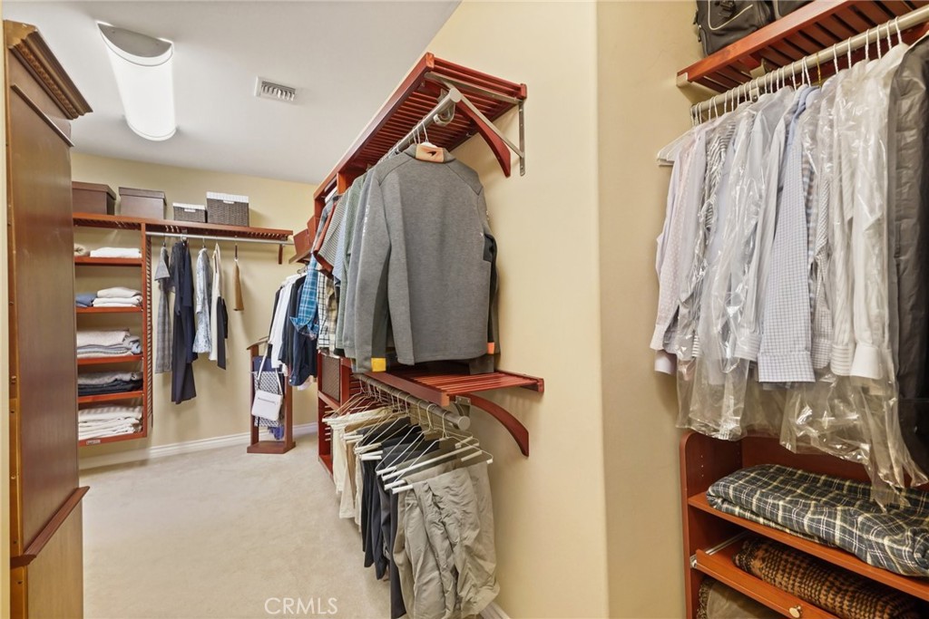 996 Blackbourne Point Oak Park, CA 91377 - Photo 45 of 75 a view of walk in closet with clothes and shoes