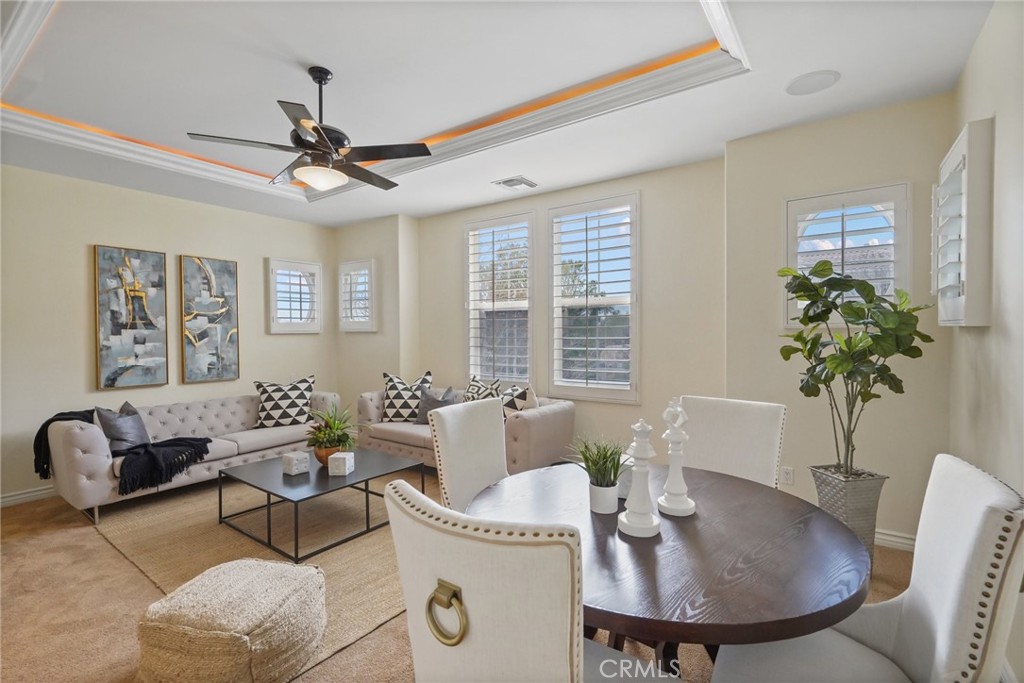 996 Blackbourne Point Oak Park, CA 91377 - Photo 51 of 75 a dining room with furniture a potted plant and a chandelier