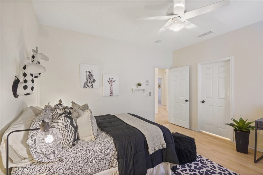 996 Blackbourne Point Oak Park, CA 91377 - Photo 53 of 75 a bedroom with a bed and a potted plant