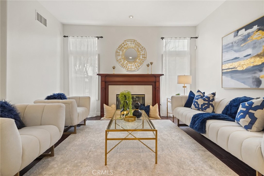 996 Blackbourne Point Oak Park, CA 91377 - Photo 8 of 75 a living room with furniture a fireplace and a large window