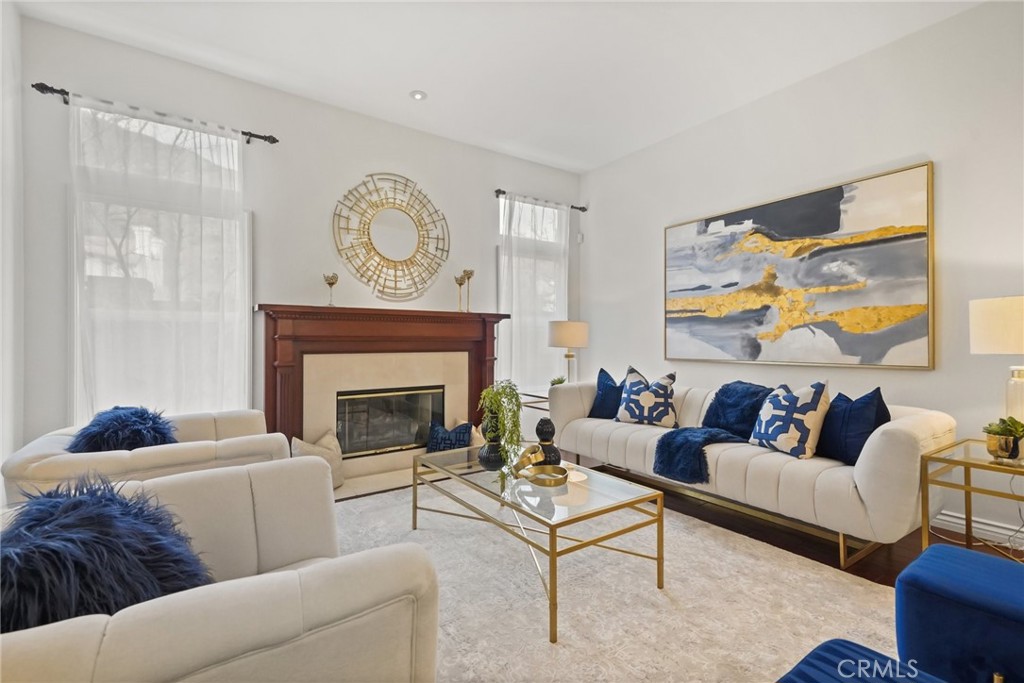 996 Blackbourne Point Oak Park, CA 91377 - Photo 9 of 75 a living room with furniture a rug and a fireplace