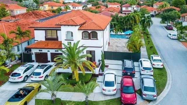 a aerial view of a house with swimming pool