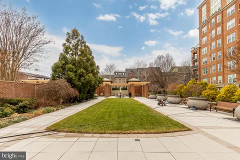 a front view of a brick building with many windows