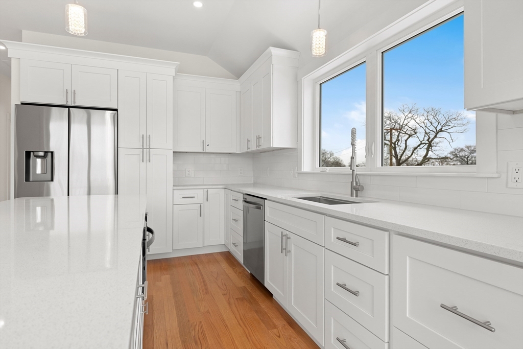 2 Old County Road, Unit 10 Salisbury, MA 01952 - Photo 6 of 27 a kitchen with a sink window and cabinets