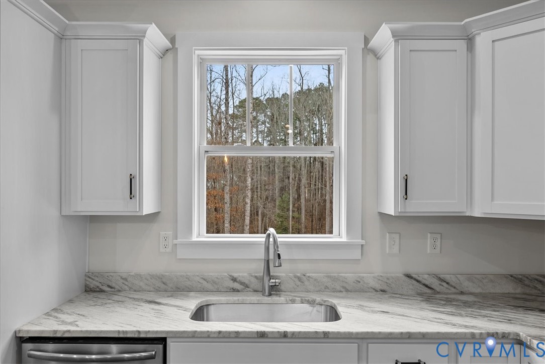 431 Raleigh Avenue South Hill, VA 23970 - Photo 12 of 27 a kitchen with granite countertop a sink and a window