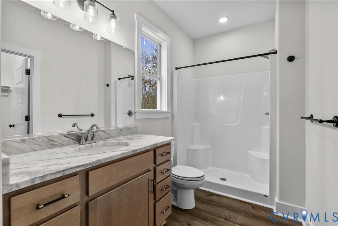 431 Raleigh Avenue South Hill, VA 23970 - Photo 19 of 27 a bathroom with a granite countertop sink toilet and shower