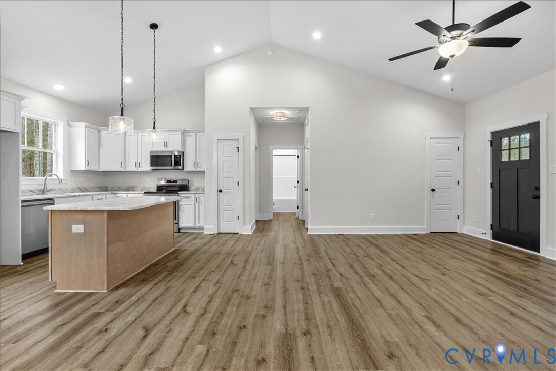 431 Raleigh Avenue South Hill, VA 23970 - Photo 21 of 27 a view of kitchen with granite countertop cabinets and wooden floor