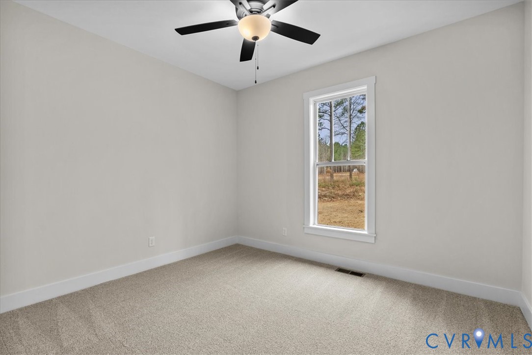 431 Raleigh Avenue South Hill, VA 23970 - Photo 22 of 27 an empty room with windows and fan