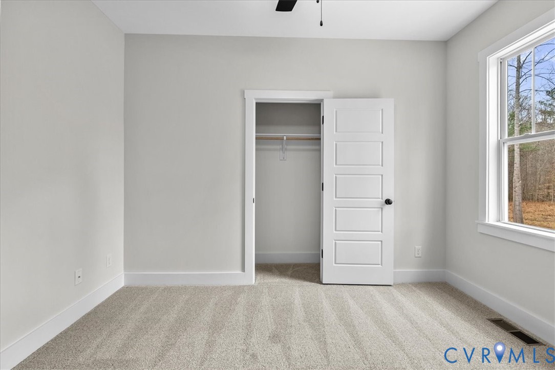 431 Raleigh Avenue South Hill, VA 23970 - Photo 26 of 27 an empty room with windows and closet