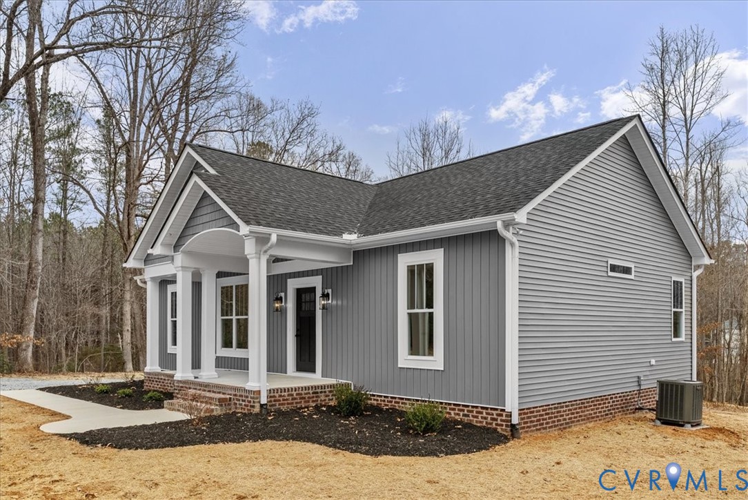 431 Raleigh Avenue South Hill, VA 23970 - Photo 5 of 27 a front view of a house with a yard and garage
