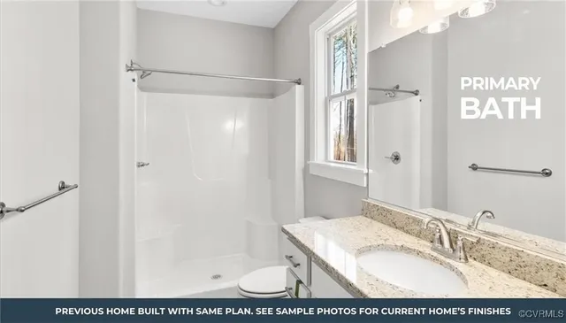 a bathroom with a granite countertop sink a mirror and shower