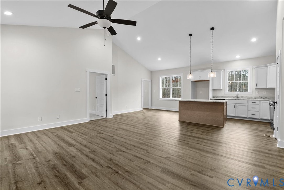 431 Raleigh Avenue South Hill, VA 23970 - Photo 9 of 27 a view of kitchen and hall with wooden floor