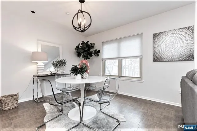 a view of a dining room with furniture window and outside view