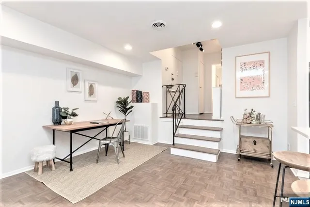 a view of a livingroom with furniture and a rug