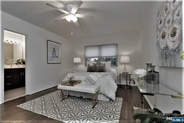 a bed room with a bed and a lamp