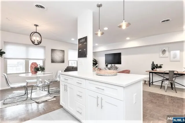 a view of kitchen center island and living room