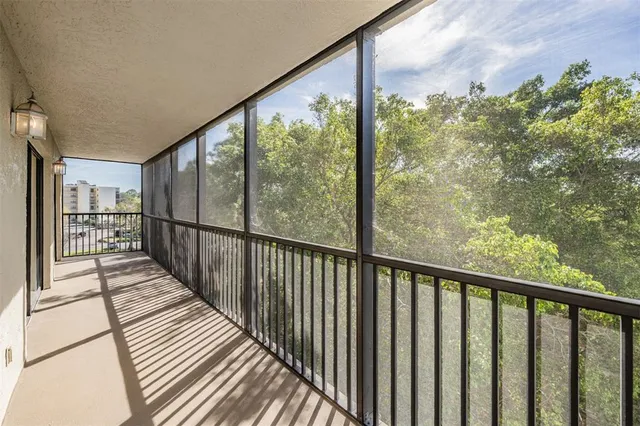 a view of a balcony with wooden floor