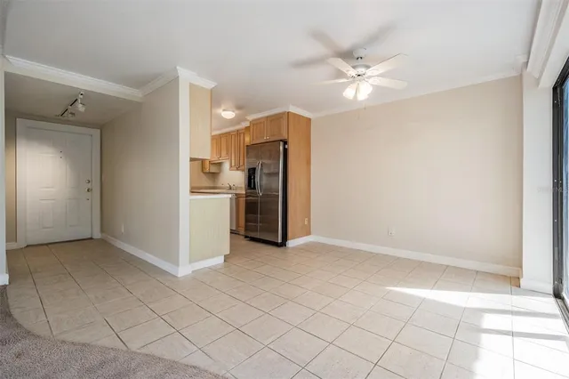a view of a kitchen with a sink and a refrigerator