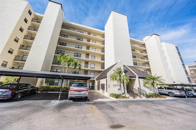 a view of building with parking area