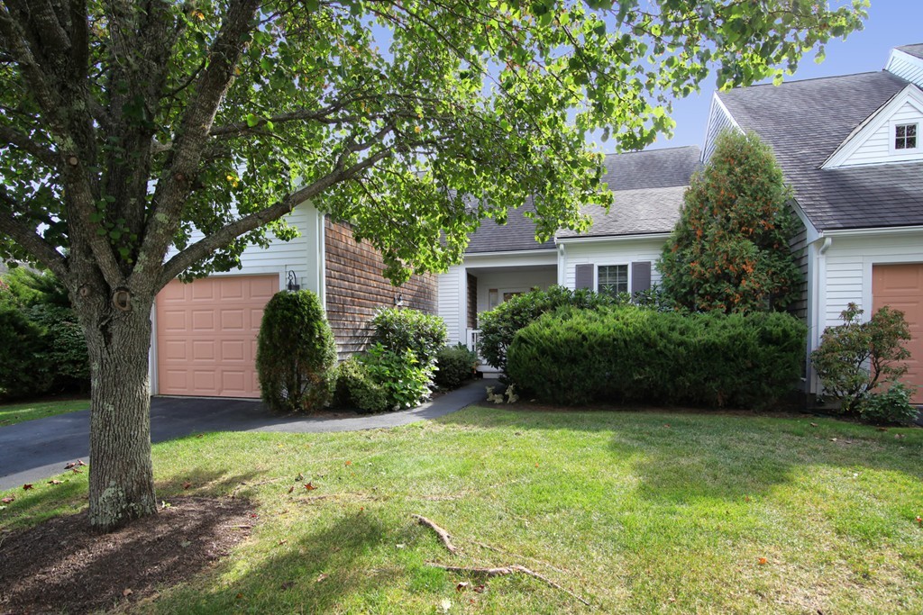 12 Stratford Ridge, Unit 12 Mashpee, MA 02649 - Photo 1 of 27 a view of a house with garden and yard