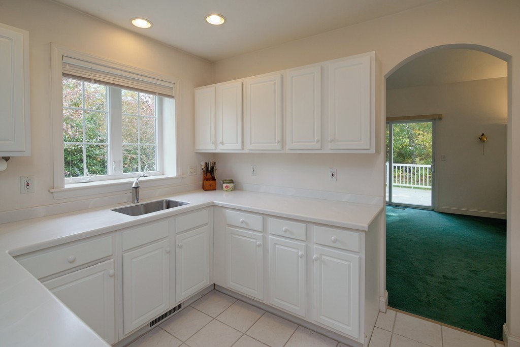 12 Stratford Ridge, Unit 12 Mashpee, MA 02649 - Photo 12 of 27 a kitchen with a sink cabinets and window