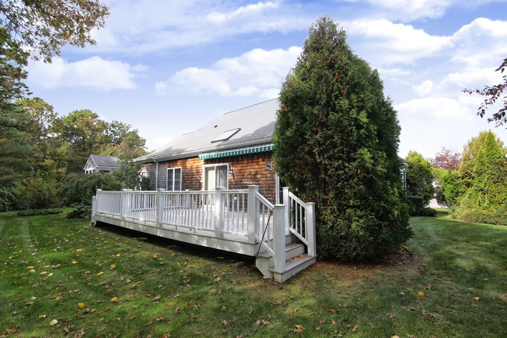 12 Stratford Ridge, Unit 12 Mashpee, MA 02649 - Photo 18 of 27 a view of a deck with a yard