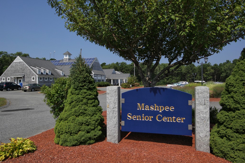 12 Stratford Ridge, Unit 12 Mashpee, MA 02649 - Photo 23 of 27 a sign on the side of a road
