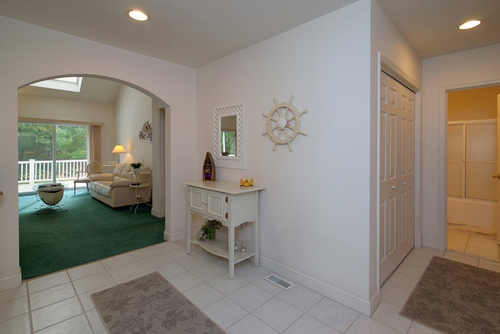 12 Stratford Ridge, Unit 12 Mashpee, MA 02649 - Photo 5 of 27 a living room with furniture and garden
