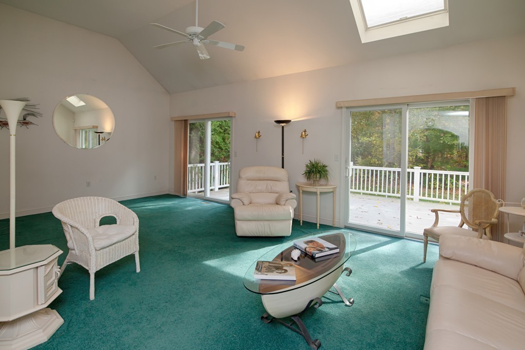 12 Stratford Ridge, Unit 12 Mashpee, MA 02649 - Photo 6 of 27 a living room with furniture and a large window