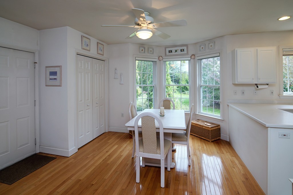 12 Stratford Ridge, Unit 12 Mashpee, MA 02649 - Photo 8 of 27 a view of a dining room with furniture window and wooden floor