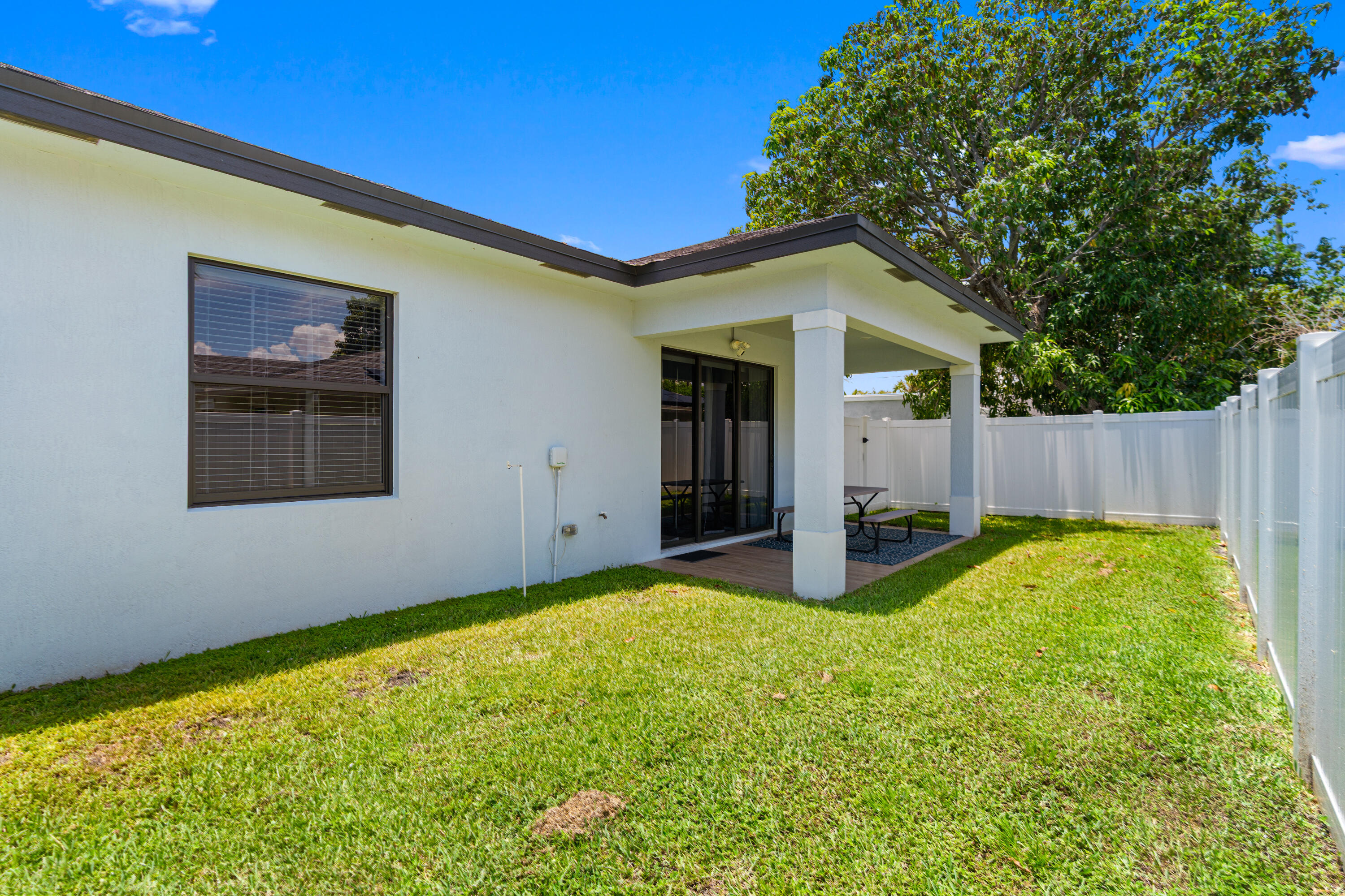 601 Southwest 3rd Street Delray Beach, FL 33444 - Photo 61 of 75 a view of a house with backyard and tree