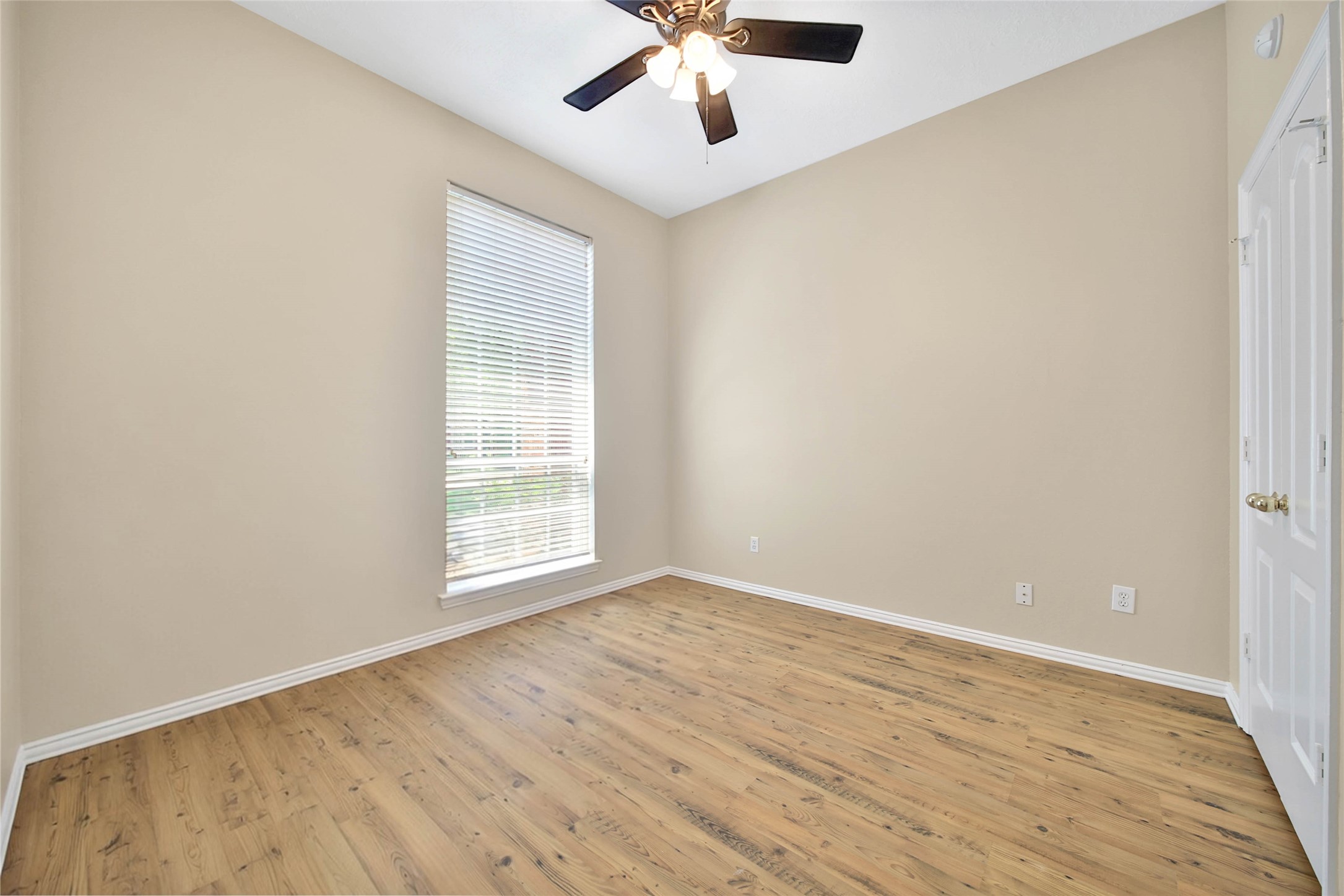 21338 Timber Pines Drive Spring, TX 77388 - Photo 25 of 29 wooden floor in an empty room with a window