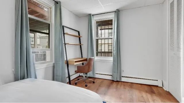 a room that has a bed and a window