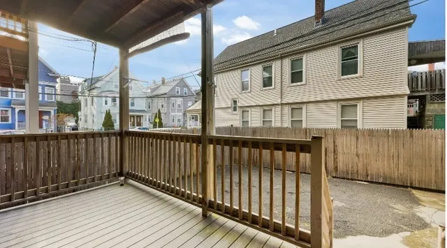 a view of a brick house with a large window
