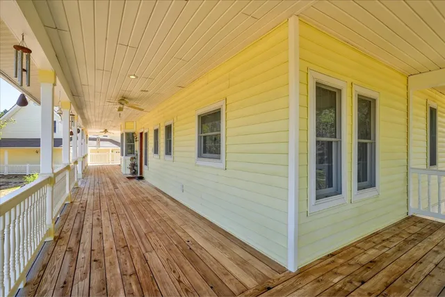 a kitchen with a refrigerator a sink and dishwasher with wooden floor