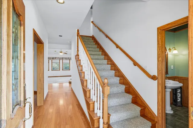 a kitchen with a stove a refrigerator and a dining table