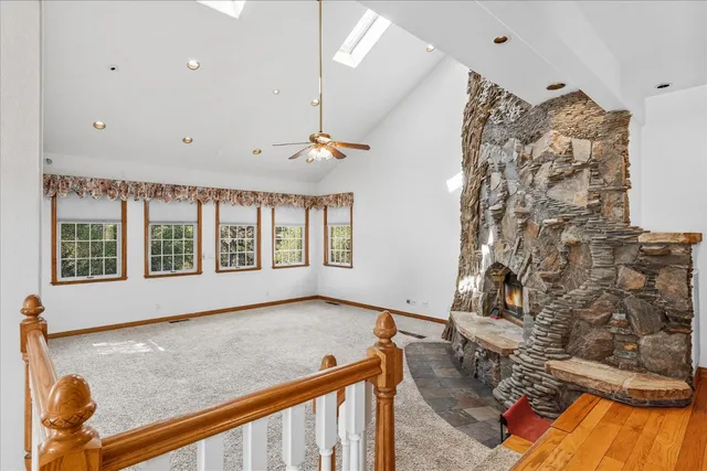 a view of a livingroom with wooden floor and a window