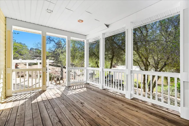 a white bath tub sitting in a bathroom next to a window