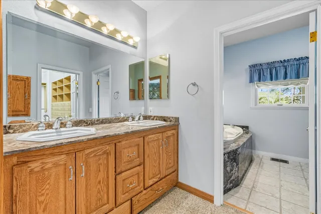 a view of a house with backyard porch and sitting area